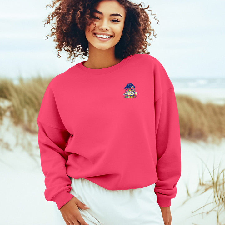 Somewhere There Is An Island Soft Style Sweatshirt Women Model Wearing Neon Pink at the Beach