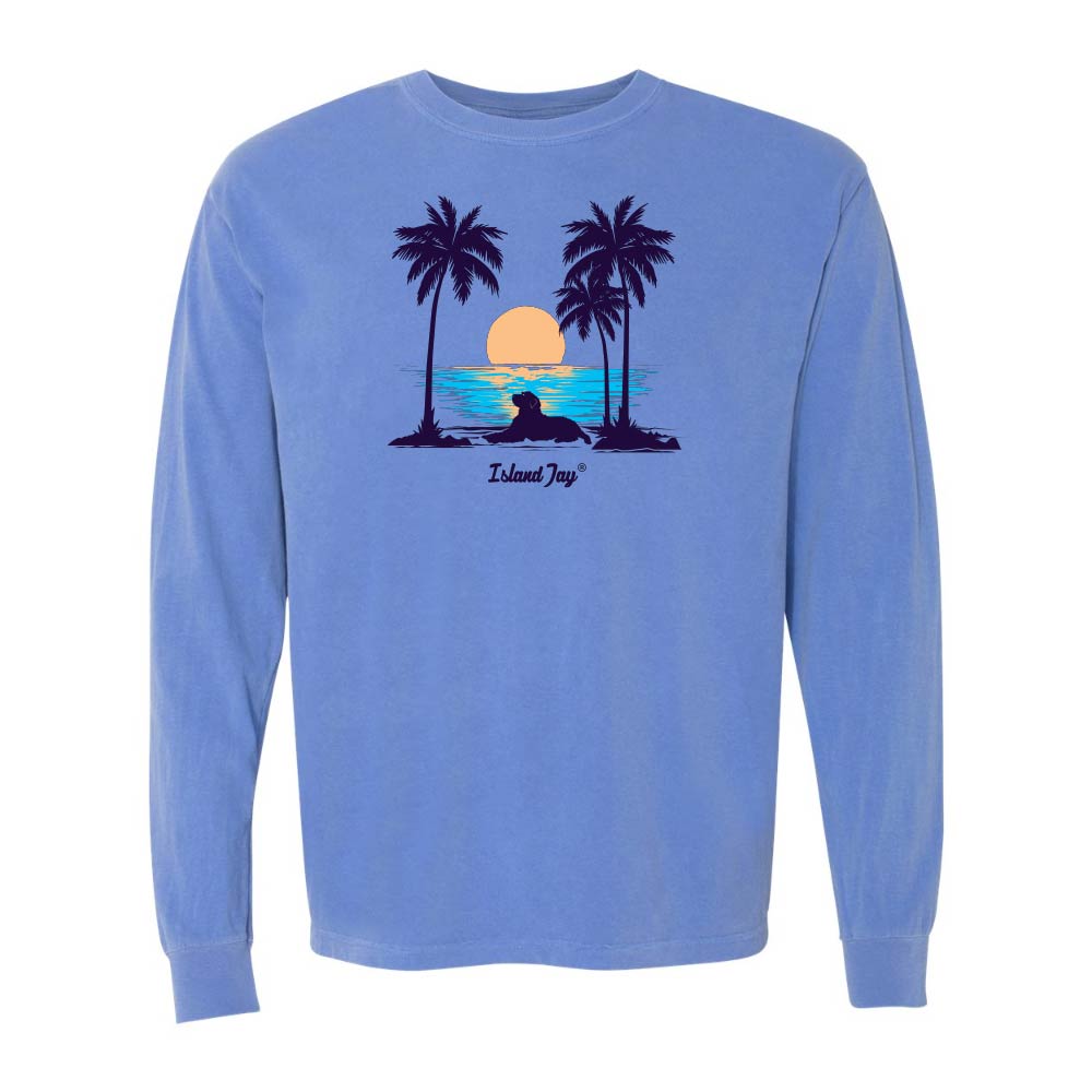 Blue Long Sleeve T-Shirt with sunset, dog and palm trees graphic.