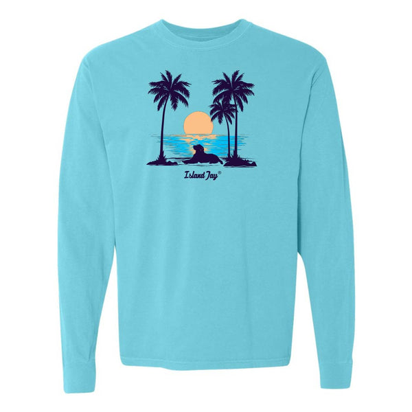 Light Blue Long Sleeve T-Shirt with sunset, dog and palm trees graphic.
