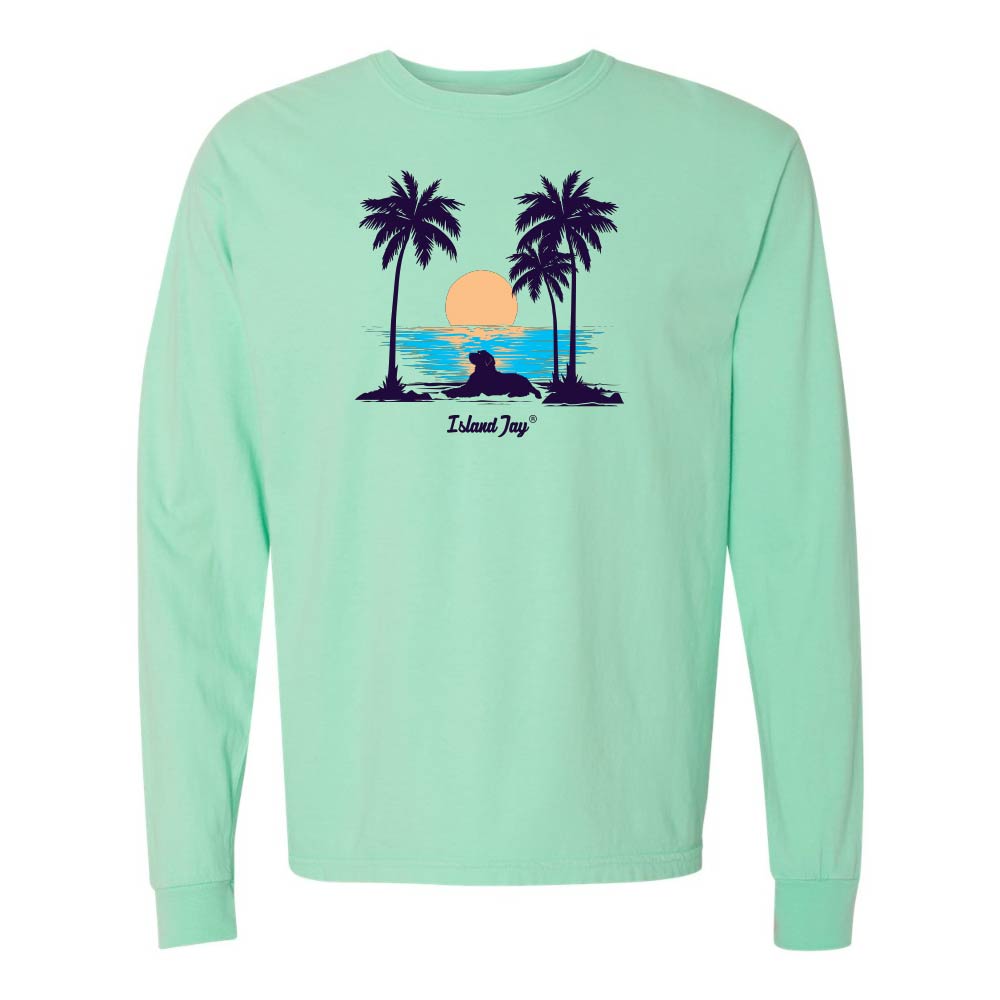 Light Green Long Sleeve T-Shirt with sunset, dog and palm trees graphic.