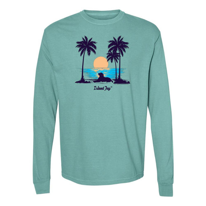 Teal Long Sleeve T-Shirt with sunset, dog and palm trees graphic.