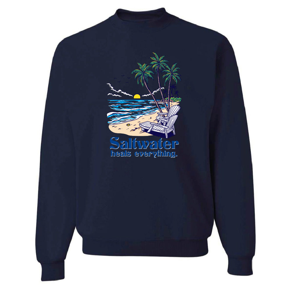 Navy blue sweatshirt with a beach graphic and 'Saltwater heals everything' text on a white background