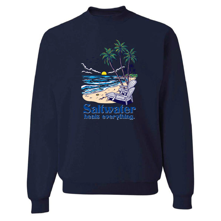 Navy blue sweatshirt with a beach graphic and 'Saltwater heals everything' text on a white background