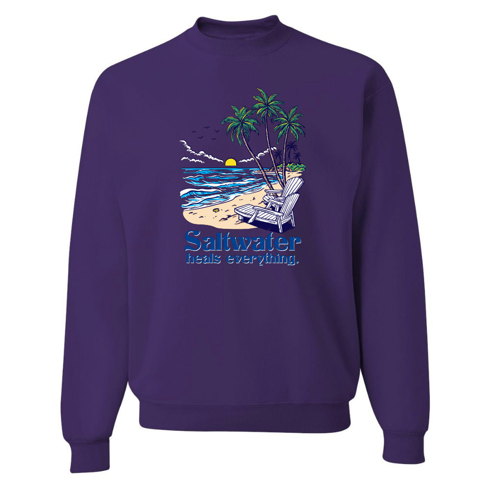 Purple sweatshirt with a beach graphic and text on a white background