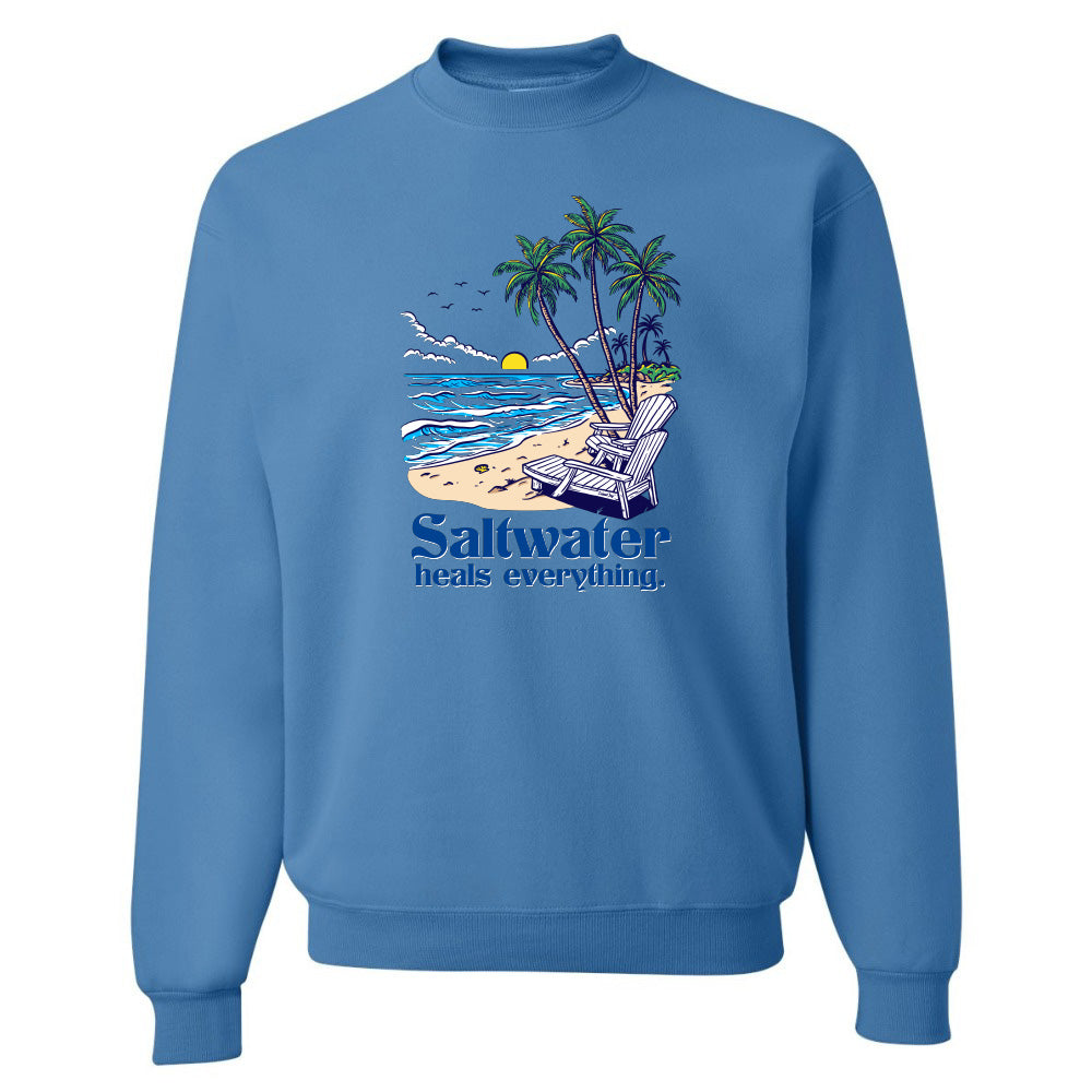 Blue sweatshirt with a beach graphic and 'Saltwater heals everything' text on a white background
