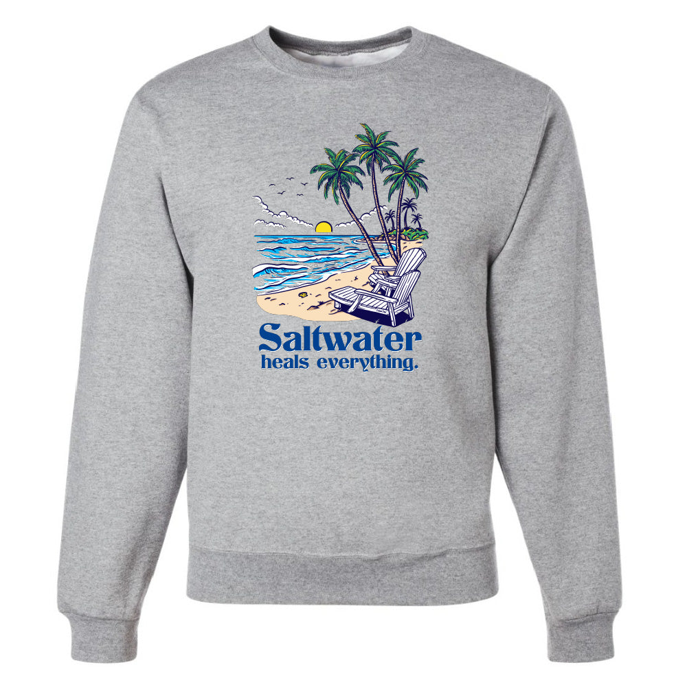 Gray sweatshirt with a beach graphic and 'Saltwater heals everything' text on a white background