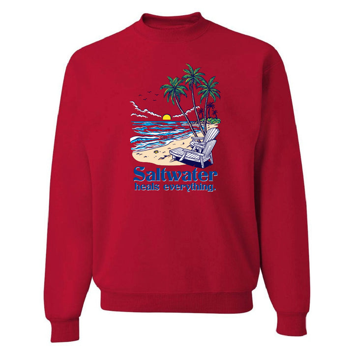 Red sweatshirt with a beach graphic and 'Saltwater heals everything' text on a white background