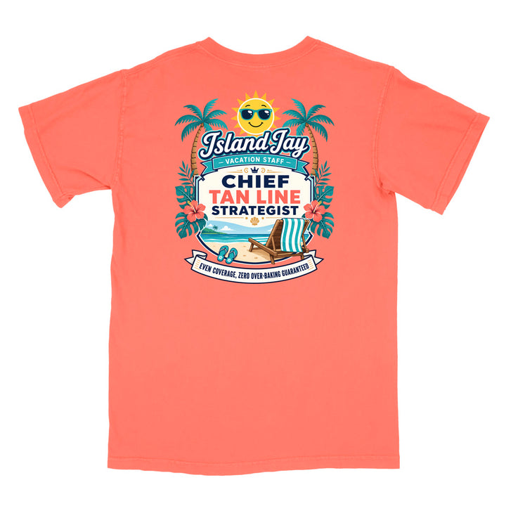 A coral short-sleeve t-shirt with a colorful graphic print on the front. The graphic features a smiling sun wearing sunglasses, palm trees, a beach scene, and text that reads 'Island Jay Vacation Staff by CHIEF TAN LINE STRATEGIST'.