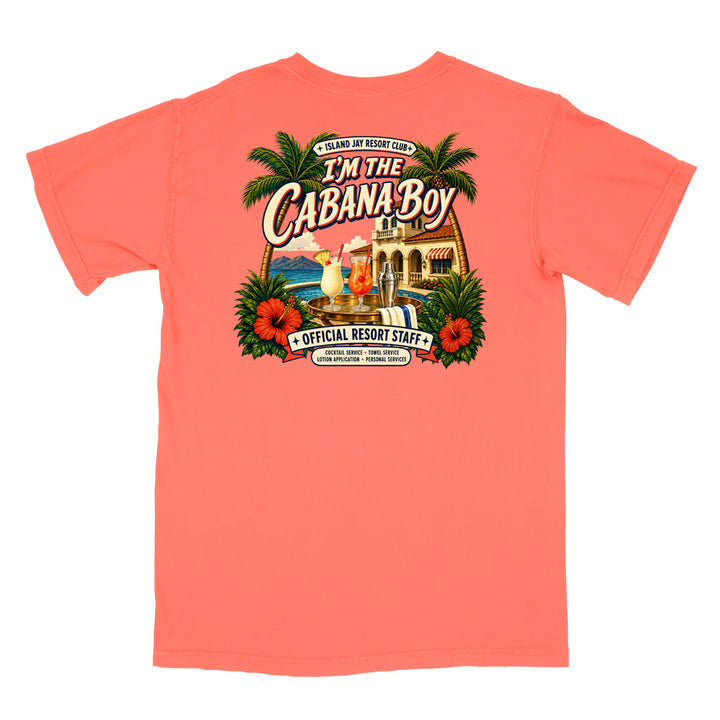 A coral pink short-sleeve t-shirt with a large, colorful graphic print on the back. The graphic features palm trees, red hibiscus flowers, a beach bar scene, and the text 'I'M THE CABANA BOY' and 'OFFICIAL RESORT STAFF'.