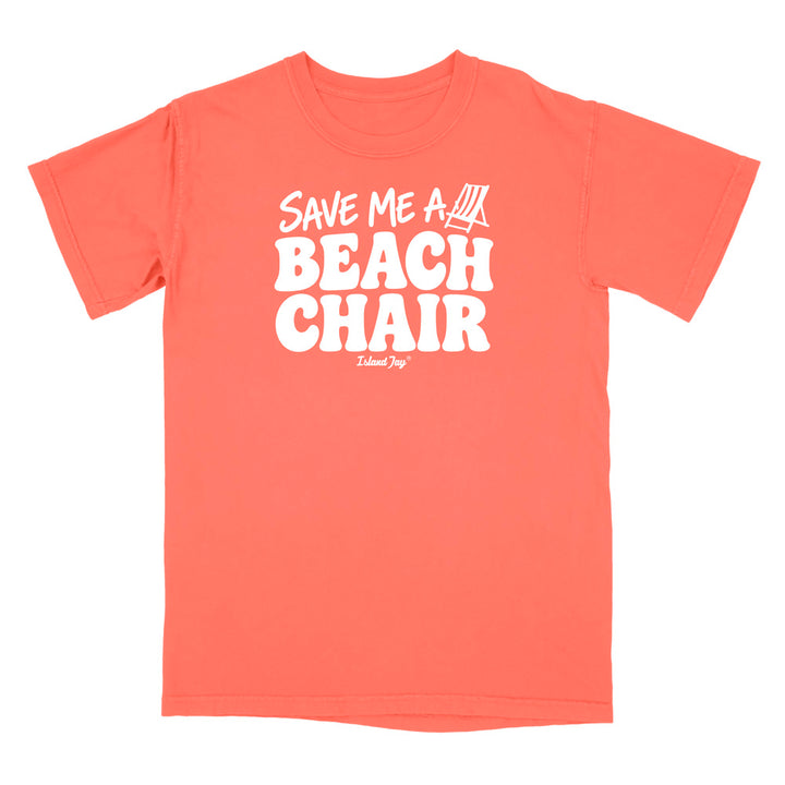 A terracotta short-sleeve t-shirt with a bold white graphic on the chest reading 'SAVE ME A BEACH CHAIR' 
