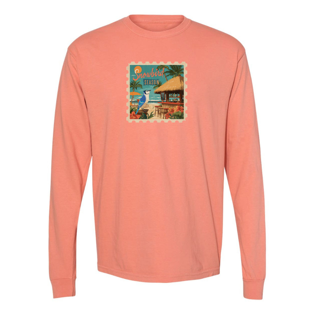 Coral long-sleeve shirt with a beach graphic on a white background