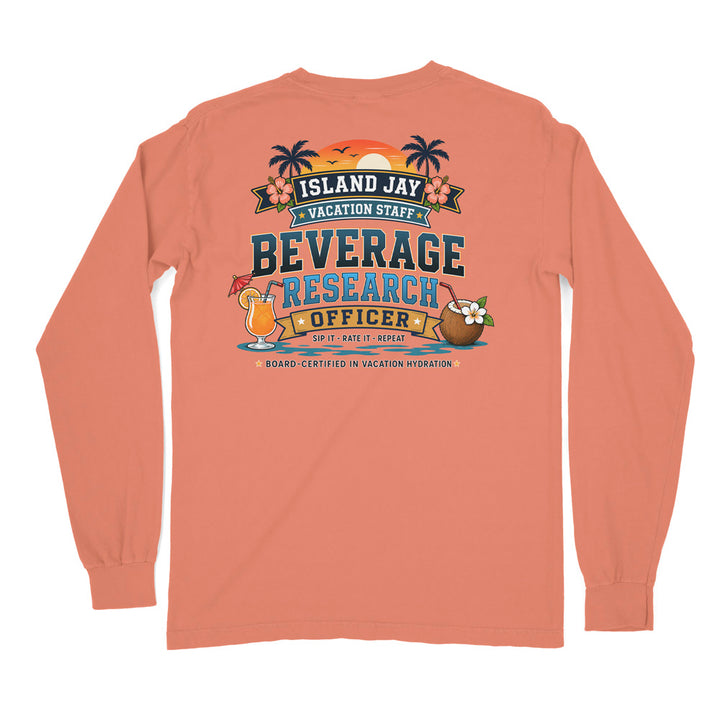 A peach-colored long-sleeve t-shirt shown from the back, featuring a colorful graphic print with tropical island-themed text reading 'ISLAND JAY VACATION STAFF BEVERAGE RESEARCH OFFICER' and cocktail/coconut illustrations.