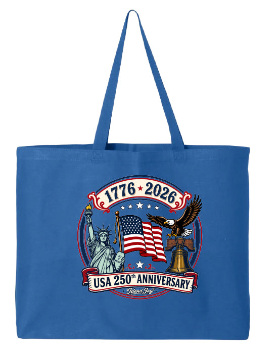 Blue tote bag with USA 250th Anniversary design featuring the Statue of Liberty, American flag, and eagle.