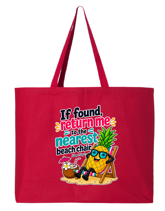 A red canvas tote bag with long handles, featuring a colorful graphic print on the front with the text 'If found, return me to the nearest beach chair' and an illustration of a pineapple wearing sunglasses and a beach chair.
