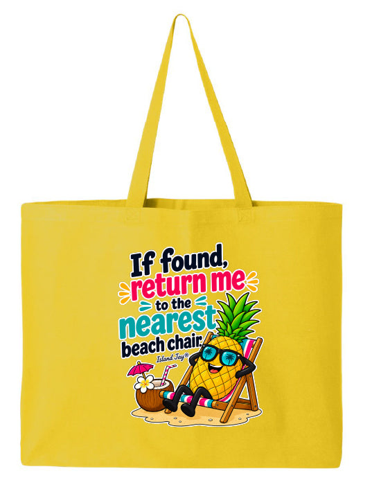 A bright yellow canvas tote bag with long handles, featuring a colorful cartoon graphic of a pineapple wearing sunglasses and relaxing in a beach chair next to a coconut drink, with the text 'If found, return me to the nearest beach chair. Island Bag'.