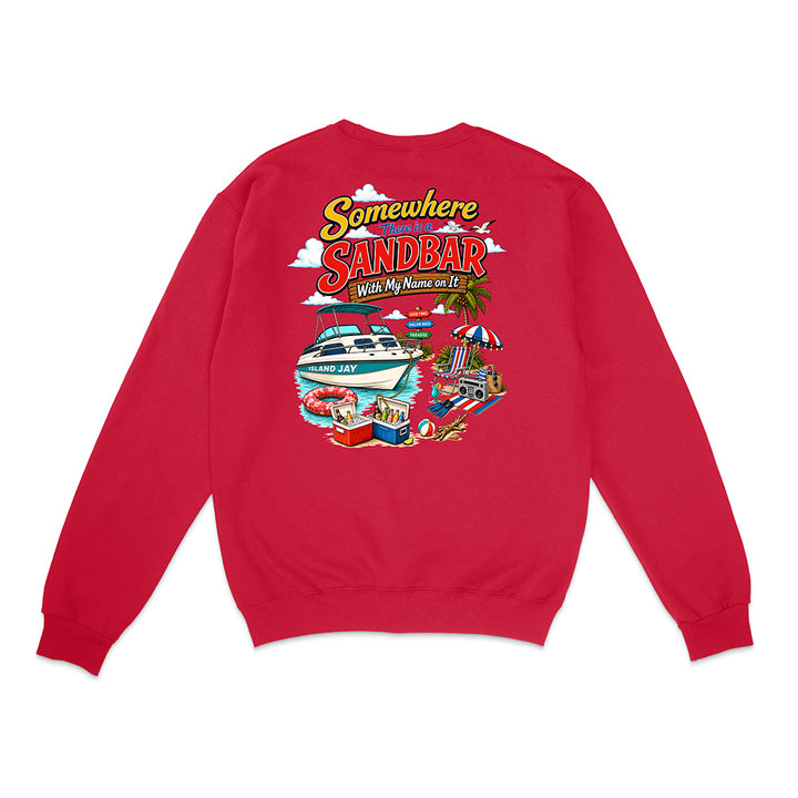 A red crewneck sweatshirt shown from the back, featuring a colorful graphic print with the text 'Somewhere in Sandbar With My Mums and Da Ba' and an illustration of a yacht, beach umbrella, and pool.