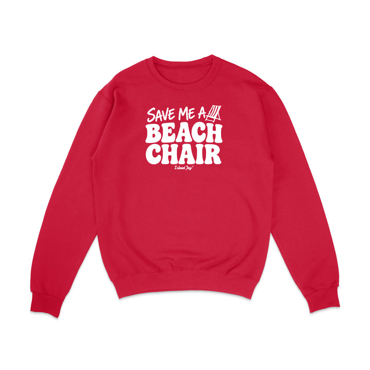 A red crewneck sweatshirt with a white graphic print on the chest that reads 'SAVE ME A BEACH CHAIR' 