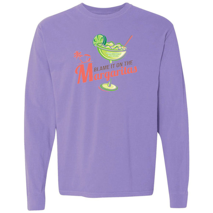Purple long-sleeve shirt with a graphic of a margarita and text 'Blame it on the Margaritas' on a white background.