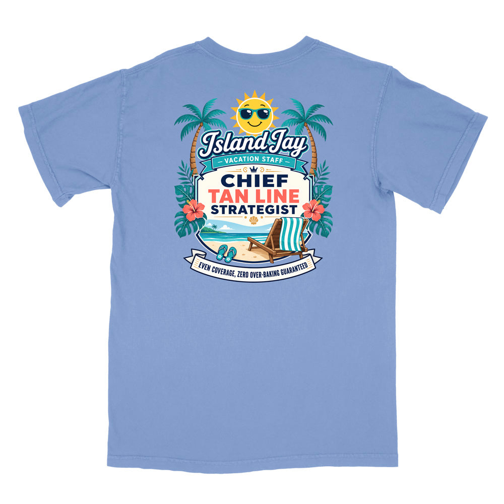 A blue short-sleeve t-shirt with a colorful graphic print on the front. The graphic features a smiling sun wearing sunglasses, palm trees, a beach scene, and text that reads 'Island Jay Vacation Staff by CHIEF TAN LINE STRATEGIST'.
