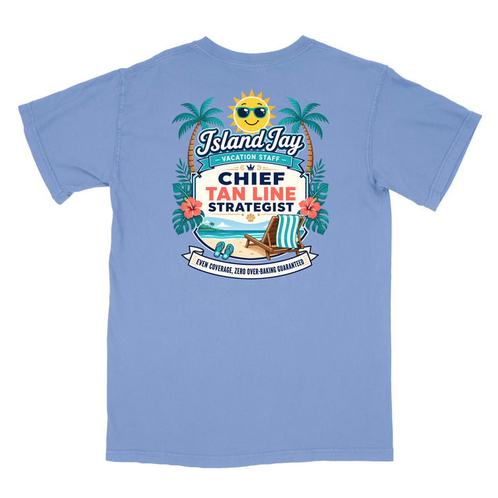 A blue short-sleeve t-shirt with a colorful graphic print on the front. The graphic features a smiling sun wearing sunglasses, palm trees, a beach scene, and text that reads 'Island Jay Vacation Staff by CHIEF TAN LINE STRATEGIST'.