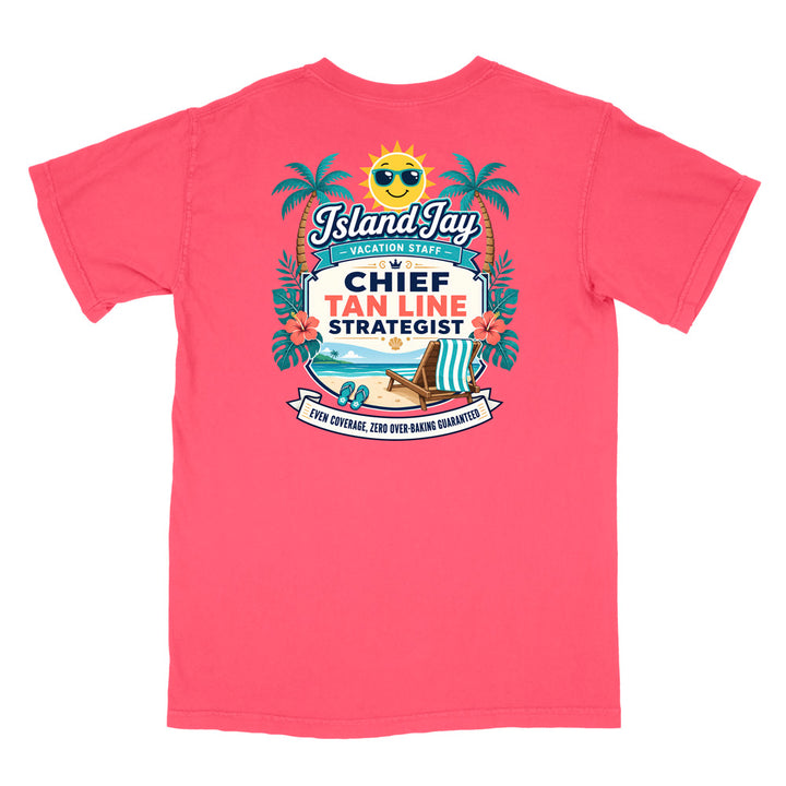 A watermelon colored short-sleeve t-shirt with a colorful graphic print on the front. The graphic features a smiling sun wearing sunglasses, palm trees, a beach scene, and text that reads 'Island Jay Vacation Staff by CHIEF TAN LINE STRATEGIST'.
