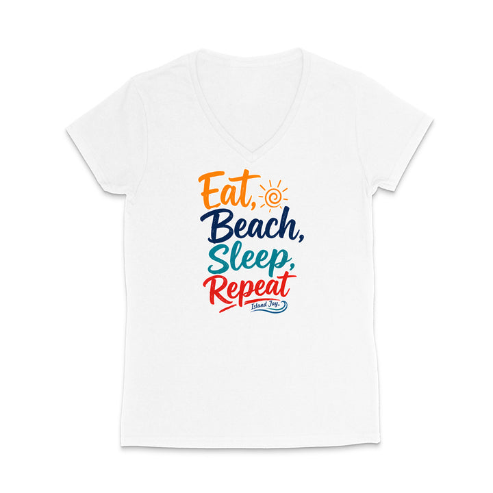 A white women's V-neck t-shirt with a colorful graphic print reading 'Eat, Beach, Sleep, Repeat' in orange, navy, teal, and red lettering, with a small sun icon and 'Follow The Sun' logo below.