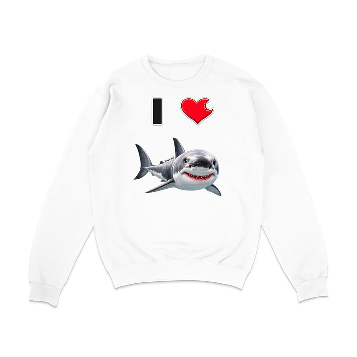 A white crewneck sweatshirt featuring a graphic print of a great white shark and the text 'I' followed by a red heart, displayed on a clean white background.