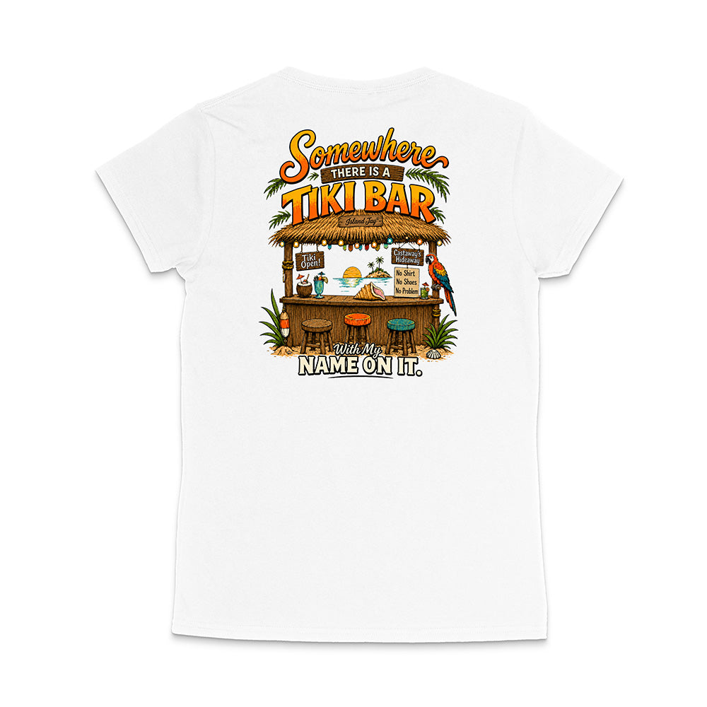 A white short-sleeve t-shirt shown from the back, featuring a colorful graphic print of a tropical 'Tiki Bar' with the text 'Somewhere there is a TIKI BAR' and 'With my NAME ON IT'.
