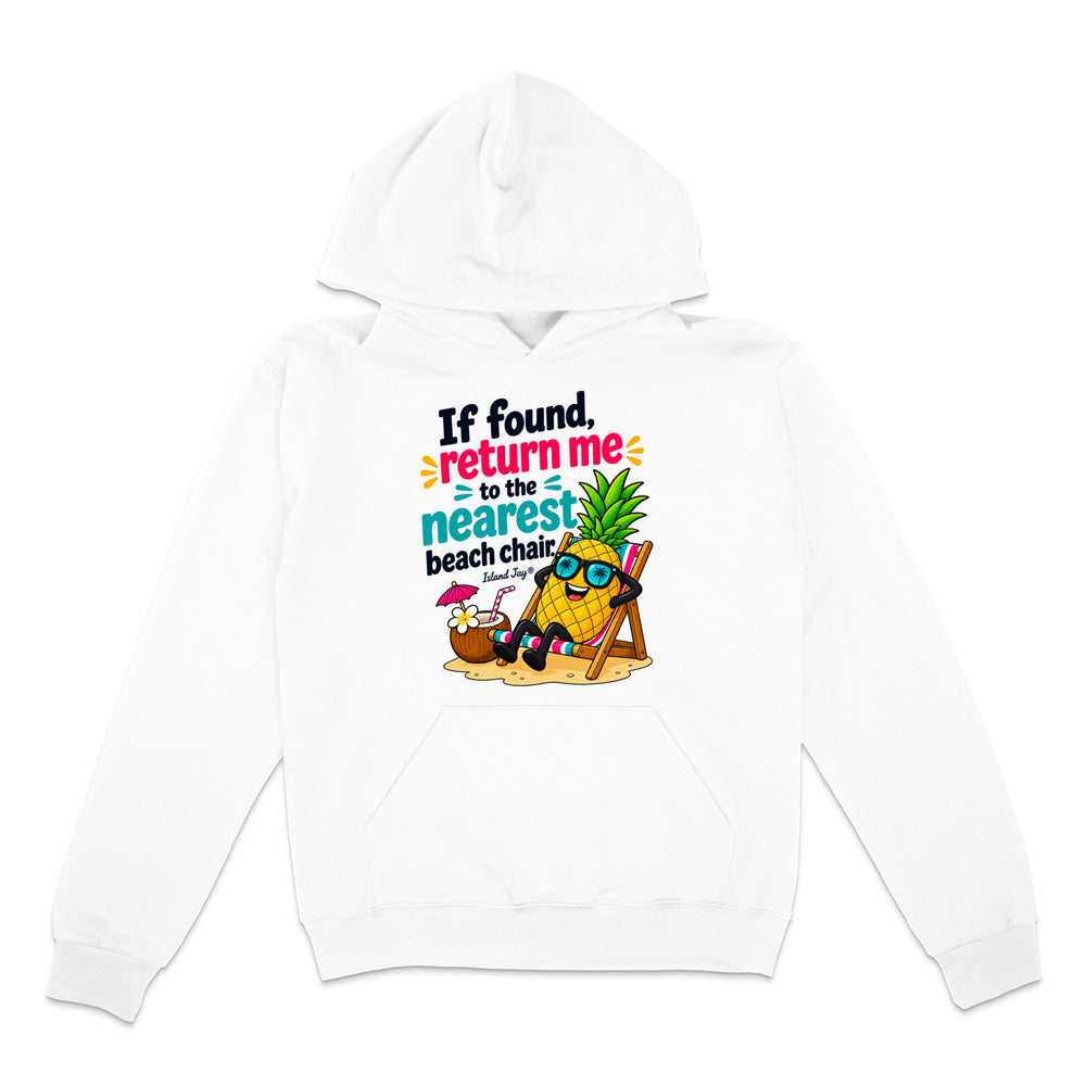 A white pullover hoodie with a colorful graphic print on the front. The graphic features a cartoon pineapple wearing sunglasses and reclining in a beach chair next to a small umbrella, with the text 'If found return me to the nearest beach chair' in black, blue, and orange lettering.