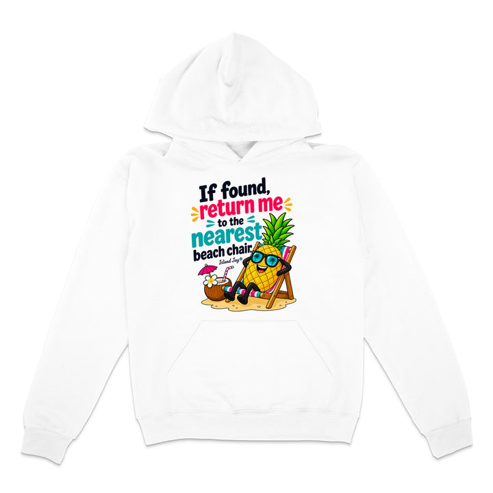 A white pullover hoodie with a colorful graphic print on the front. The graphic features a cartoon pineapple wearing sunglasses and reclining in a beach chair next to a small umbrella, with the text 'If found return me to the nearest beach chair' in black, blue, and orange lettering.
