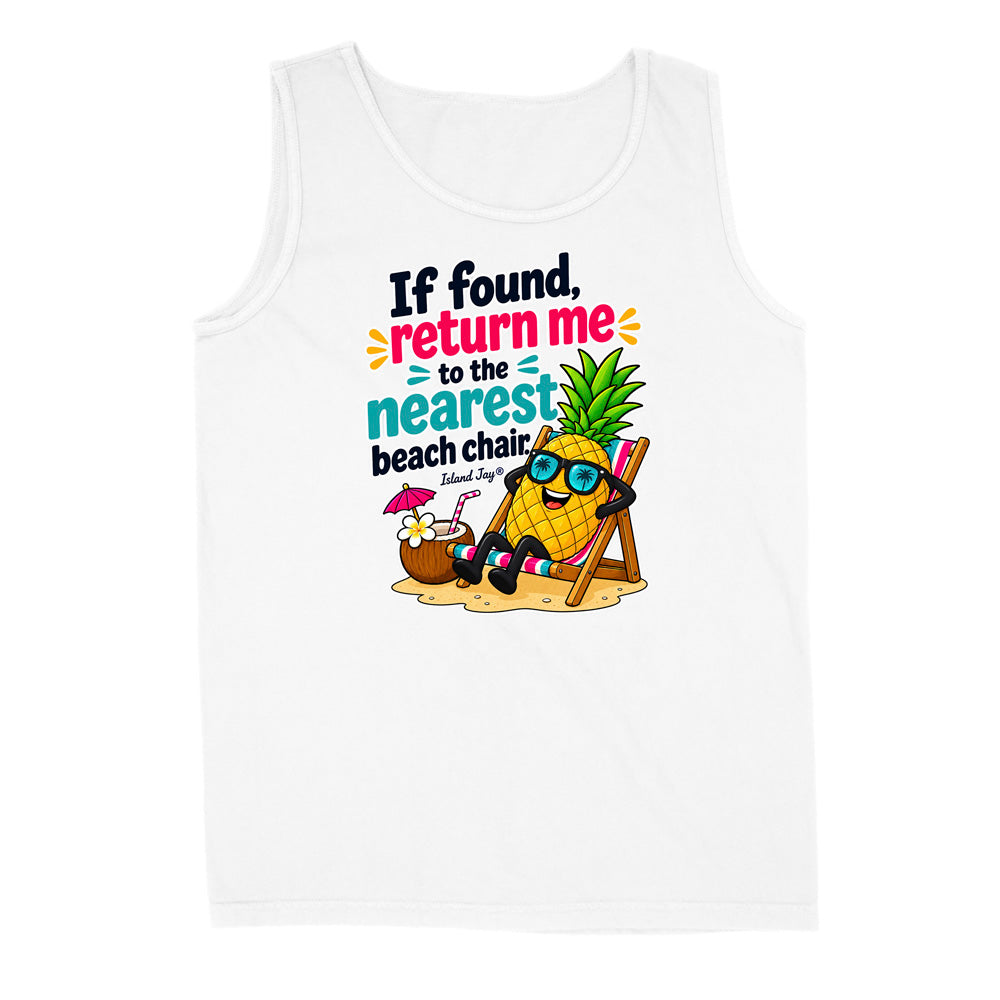 A white sleeveless tank top with a colorful graphic print on the front. The graphic features a cartoon pineapple wearing sunglasses and reclining in a beach chair next to a coconut drink, with the text 'If found, return me to the nearest beach chair.