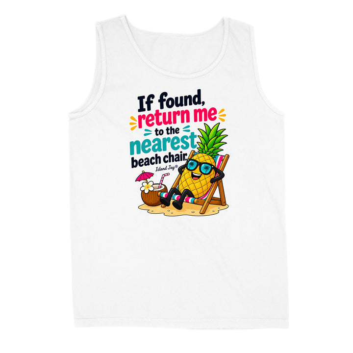 A white sleeveless tank top with a colorful graphic print on the front. The graphic features a cartoon pineapple wearing sunglasses and reclining in a beach chair next to a coconut drink, with the text 'If found, return me to the nearest beach chair.