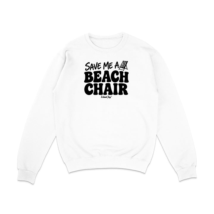 A white crewneck sweatshirt with a black graphic print on the front that reads 'SAVE ME A BEACH CHAIR'