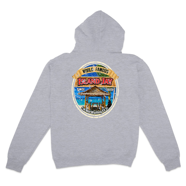 A heather gray pullover hoodie shown from the back, featuring a large circular graphic print on the center back with a beach scene, a thatched-roof structure, and the words 'World Famous Island Jay' and 'Since 2015'.