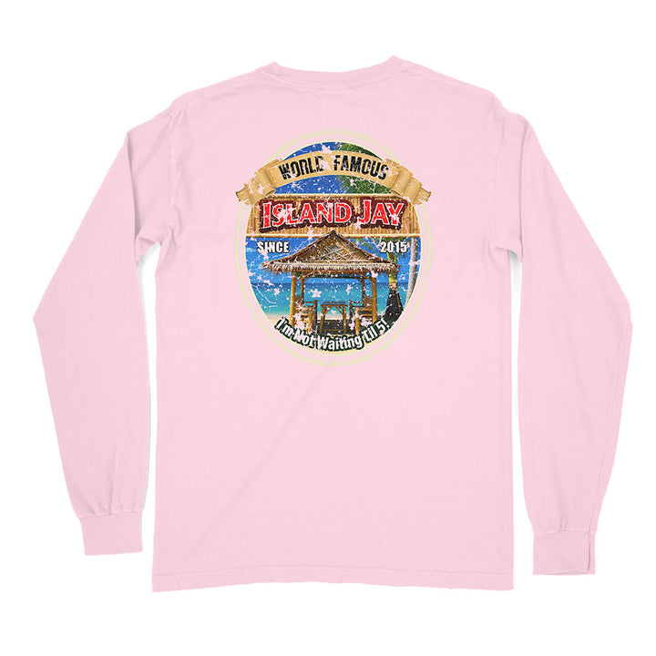 A light pink long-sleeve t-shirt shown from the back, featuring a large circular graphic print on the upper back with a beach cabana, blue water, and the text 'WORLD FAMOUS ISLAND JAY' and 'SINCE 2019'.