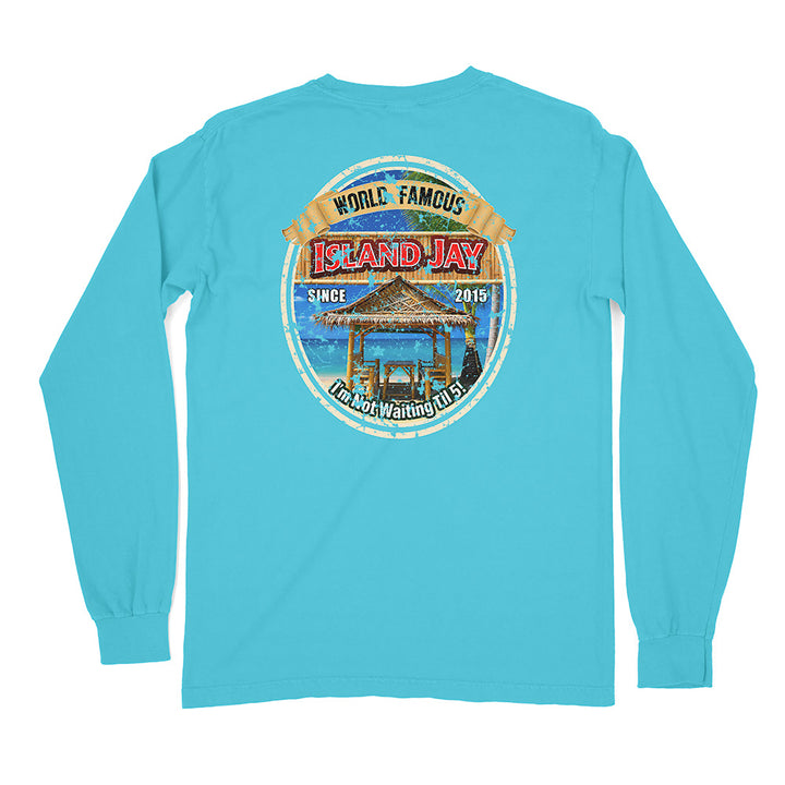 A light blue long-sleeve t-shirt shown from the back, featuring a large circular graphic print on the upper back with a beach bar scene and the text 'World Famous Island Jay' and 'Since 2019'.