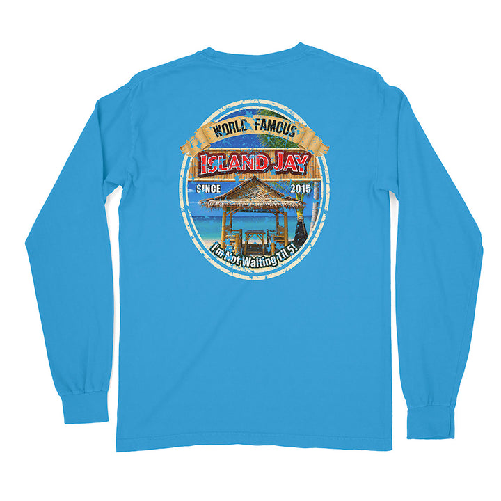 A bright blue long-sleeve t-shirt shown from the back, featuring a large circular graphic print on the center back with a beach scene and the text 'WORLD FAMOUS ISLAND JAY' and 'KAMPWAiting Club'.