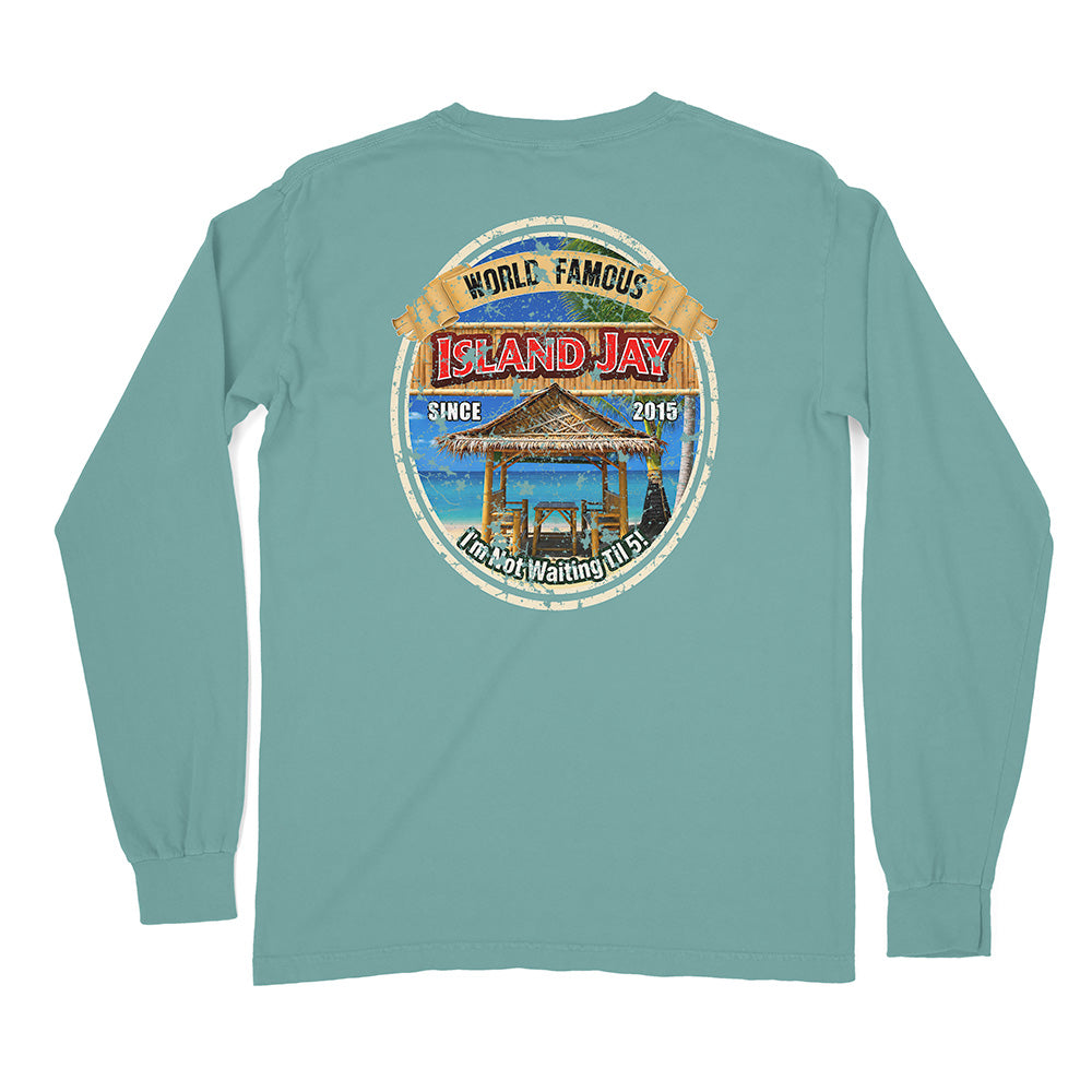 A long-sleeve t-shirt in a muted teal color, shown from the back. It features a large circular graphic print in the center with a beach scene and the text 'WORLD FAMOUS ISLAND JAY' and 'SINCE 2015 I CAN'T WAIT TO COME'.