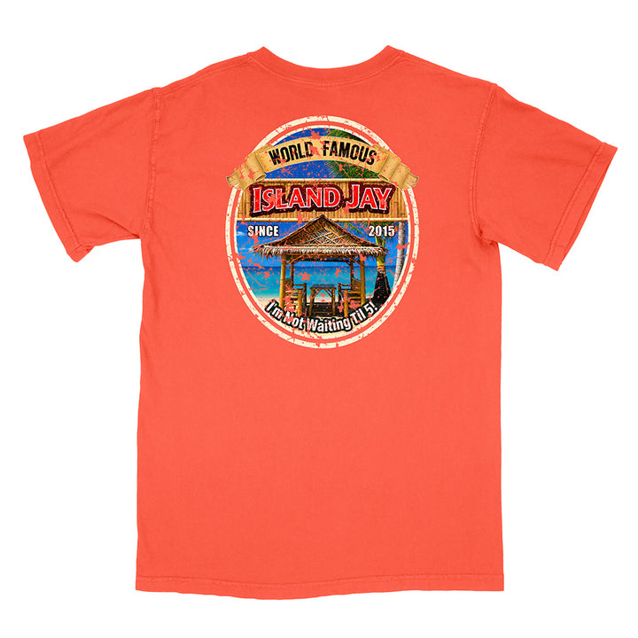 A coral orange short-sleeve t-shirt shown from the back, featuring a large circular graphic print on the center back with a tropical island hut, blue sky, and text reading 'WORLD FAMOUS ISLAND JAY' and 'I'm Not Waiting For You'.
