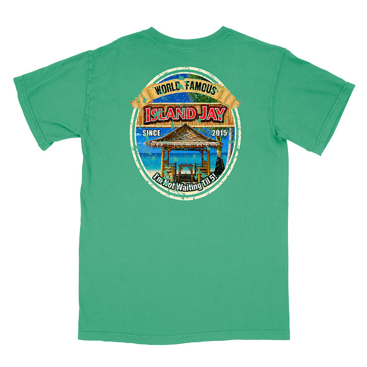 A green short-sleeve t-shirt shown from the back, featuring a large circular graphic print on the center back with a beach bar scene and the text 'ISLAND JAY' and 'WORLD FAMOUS'.