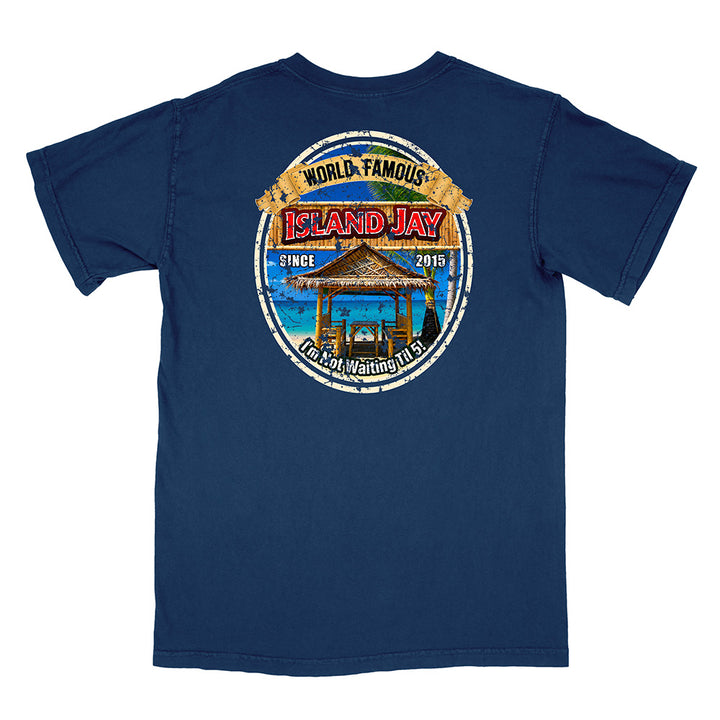 A navy blue short-sleeve t-shirt shown from the back, featuring a large circular graphic print on the center back with a beach hut, blue sky, and distressed text reading 'World Famous Island Jay' and 'I'm Not Waiting For You'.