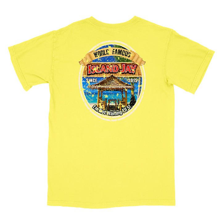 A bright yellow short-sleeve t-shirt shown from the back, featuring a large circular graphic print on the center back with a beach bar scene and the text 'World Famous Island Jay' and 'Don't Wait for It'.
