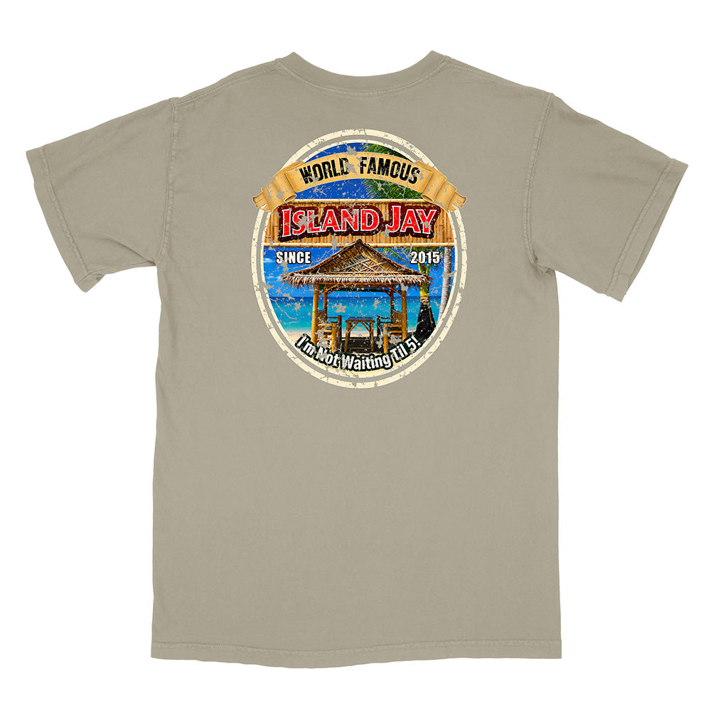 A light gray short-sleeve t-shirt with a large circular graphic on the back. The graphic features a tropical beach scene with a thatched umbrella, blue water, and a banner reading 'WORLD FAMOUS ISLAND JAY'.