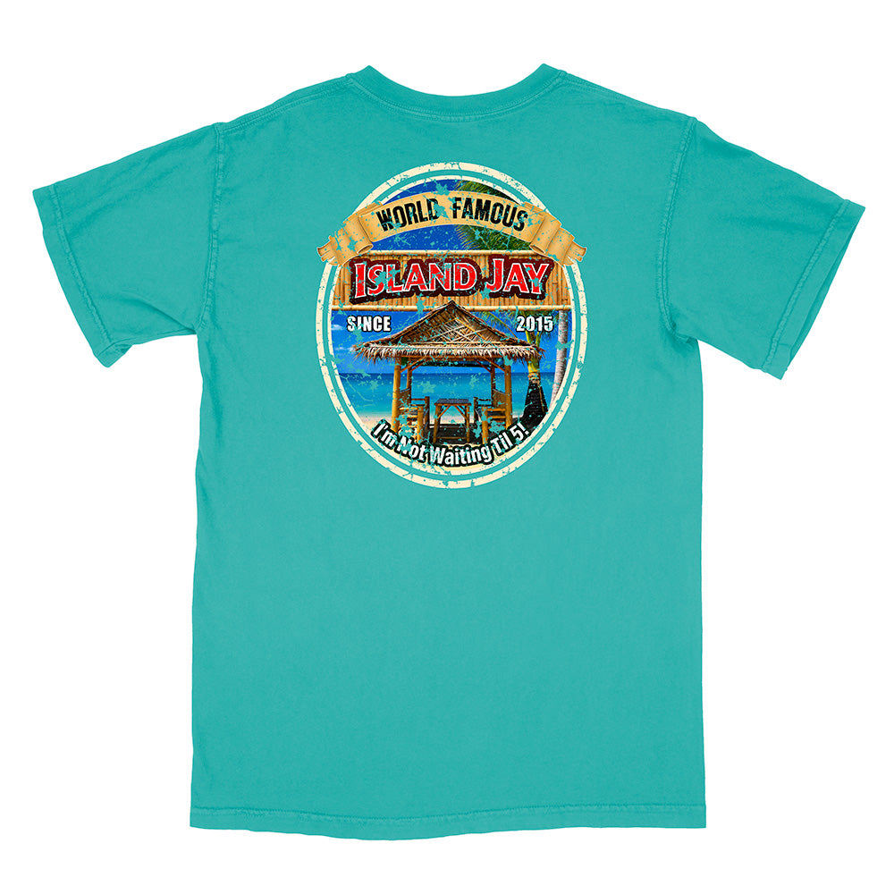 A turquoise short-sleeve t-shirt with a large circular graphic on the back. The graphic features a tropical beach scene with a thatched-roof gazebo, blue water, and a yellow banner reading 'WORLD FAMOUS ISLAND JAY'.