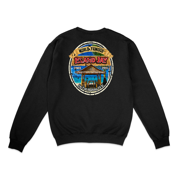 A black crewneck sweatshirt shown from the back, featuring a large circular graphic print on the upper back with a beach pavilion illustration and the text 'World Famous Island Jay' and 'Culinary Master'.