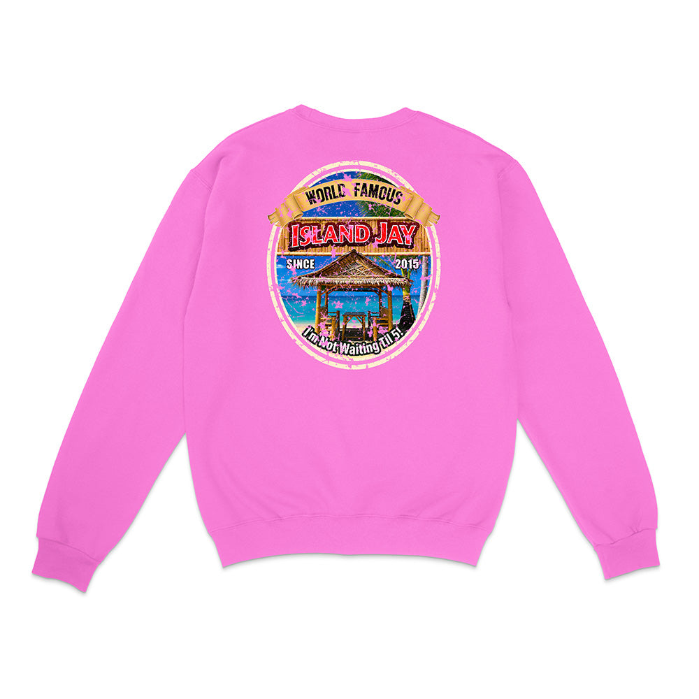 A bright pink crewneck sweatshirt shown from the back, featuring a large circular graphic print on the center back with a beach cabana illustration and the text 'World Famous Island Hay'.
