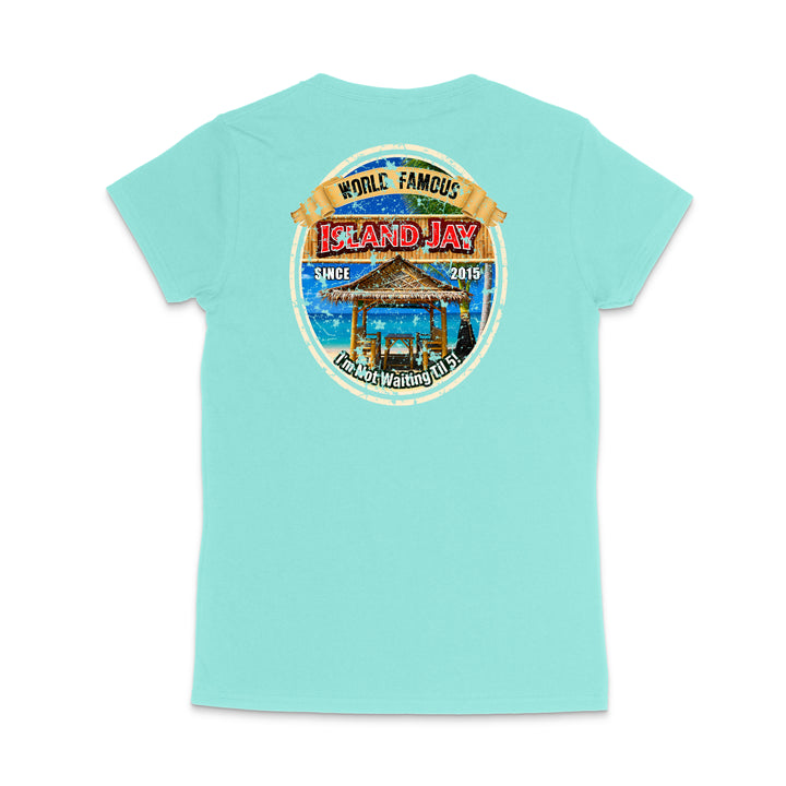 A light turquoise short-sleeve t-shirt shown from the back, featuring a large circular graphic print on the upper back with a beach scene, a gazebo, and text reading 'World Famous Island Jay' and 'Grand Bay Walking Club'.