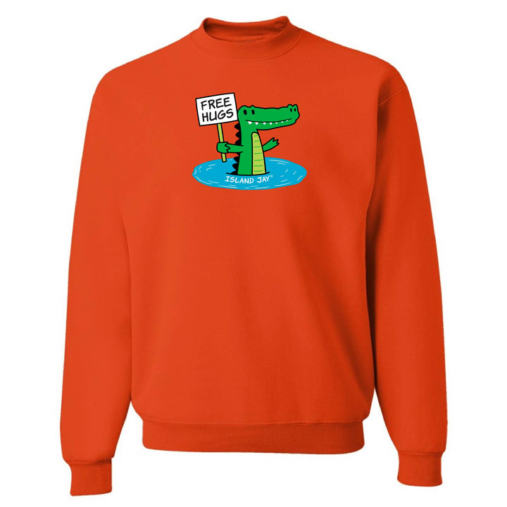 Orange sweatshirt with a cartoon alligator holding a 'Free Hugs' sign on a white background
