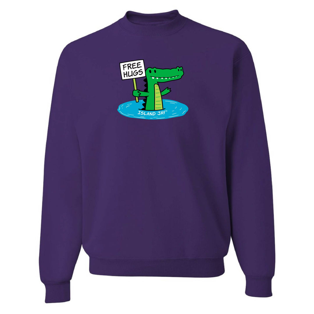 Purple sweatshirt with a cartoon alligator holding a 'Free Hugs' sign on a white background