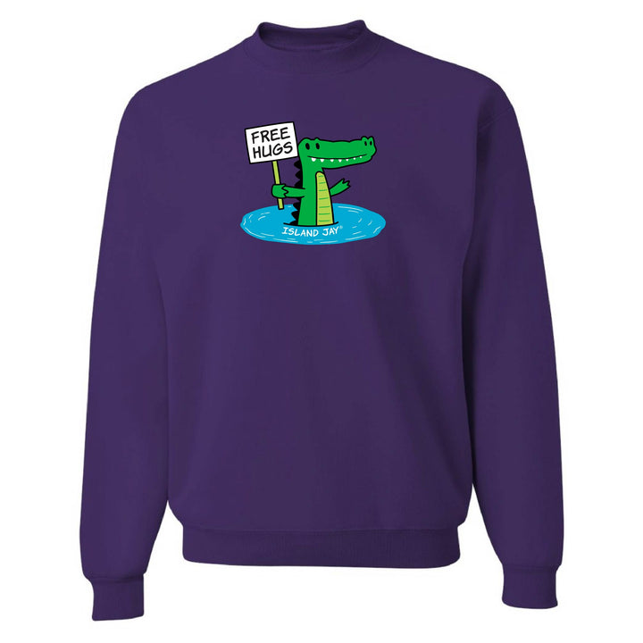 Purple sweatshirt with a cartoon alligator holding a 'Free Hugs' sign on a white background